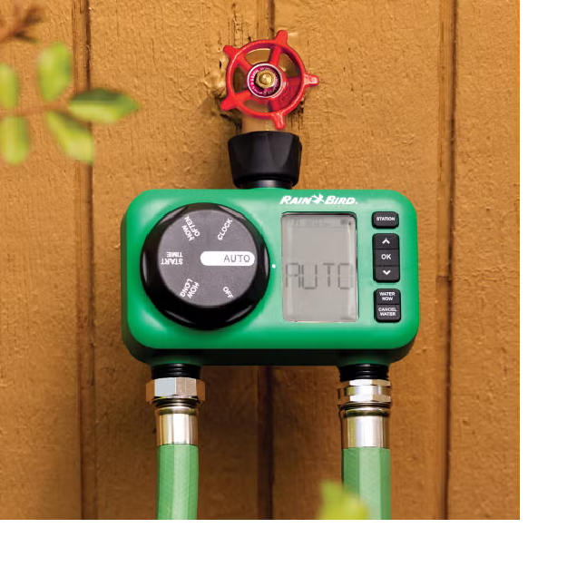 2-Station Electronic Hose End Timer hooked up to a hose bib on the side of a house