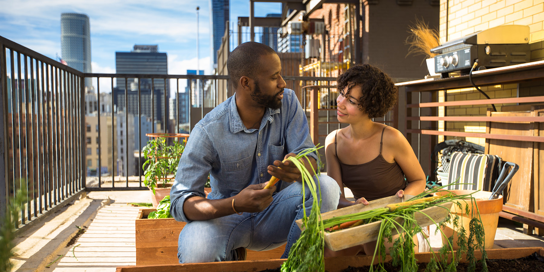 couple gardening on a rooftop