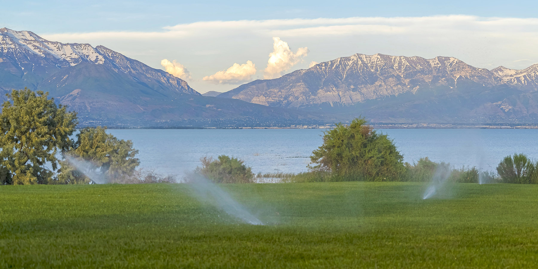 sprinklers with mountain scene