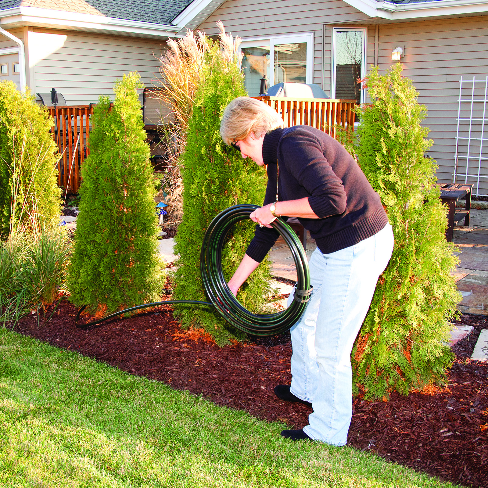 uncoiling Rain Bird drip irrigation tubing