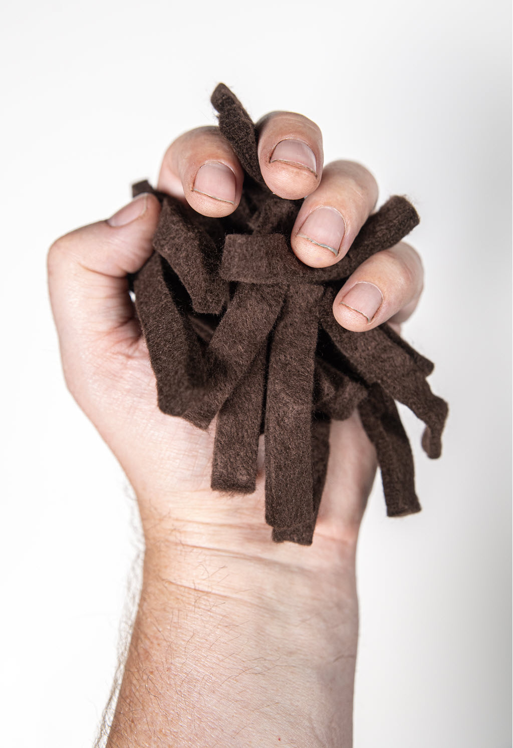Root Booster - Brown Strips in hand