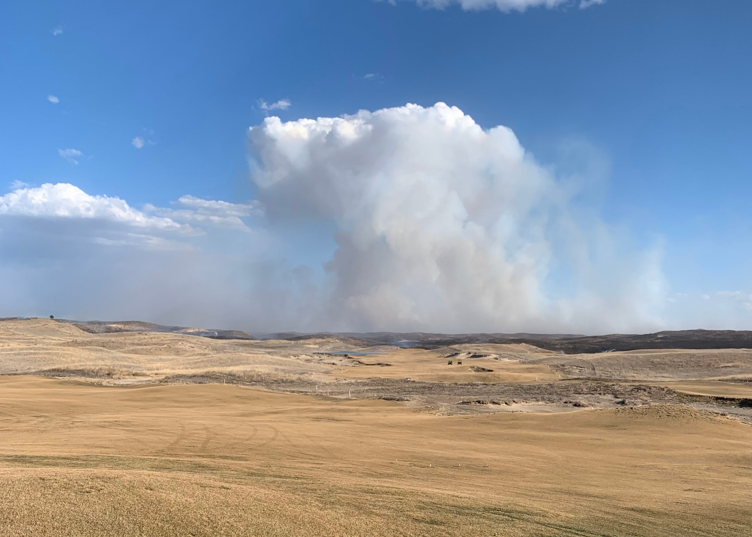 Plume of smoke rises above Sandhills of Nebraska