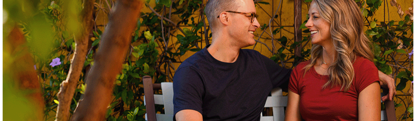 People sitting on bench with tree in foreground - consumer products e-newsletter sign up