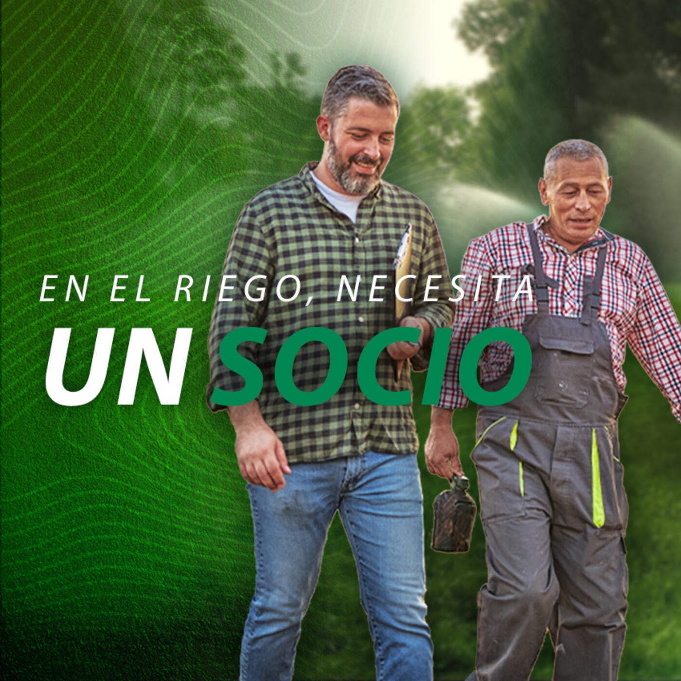 Landscape contractor walking alongside another man in a field with irrigation sprinklers shooting water in the background